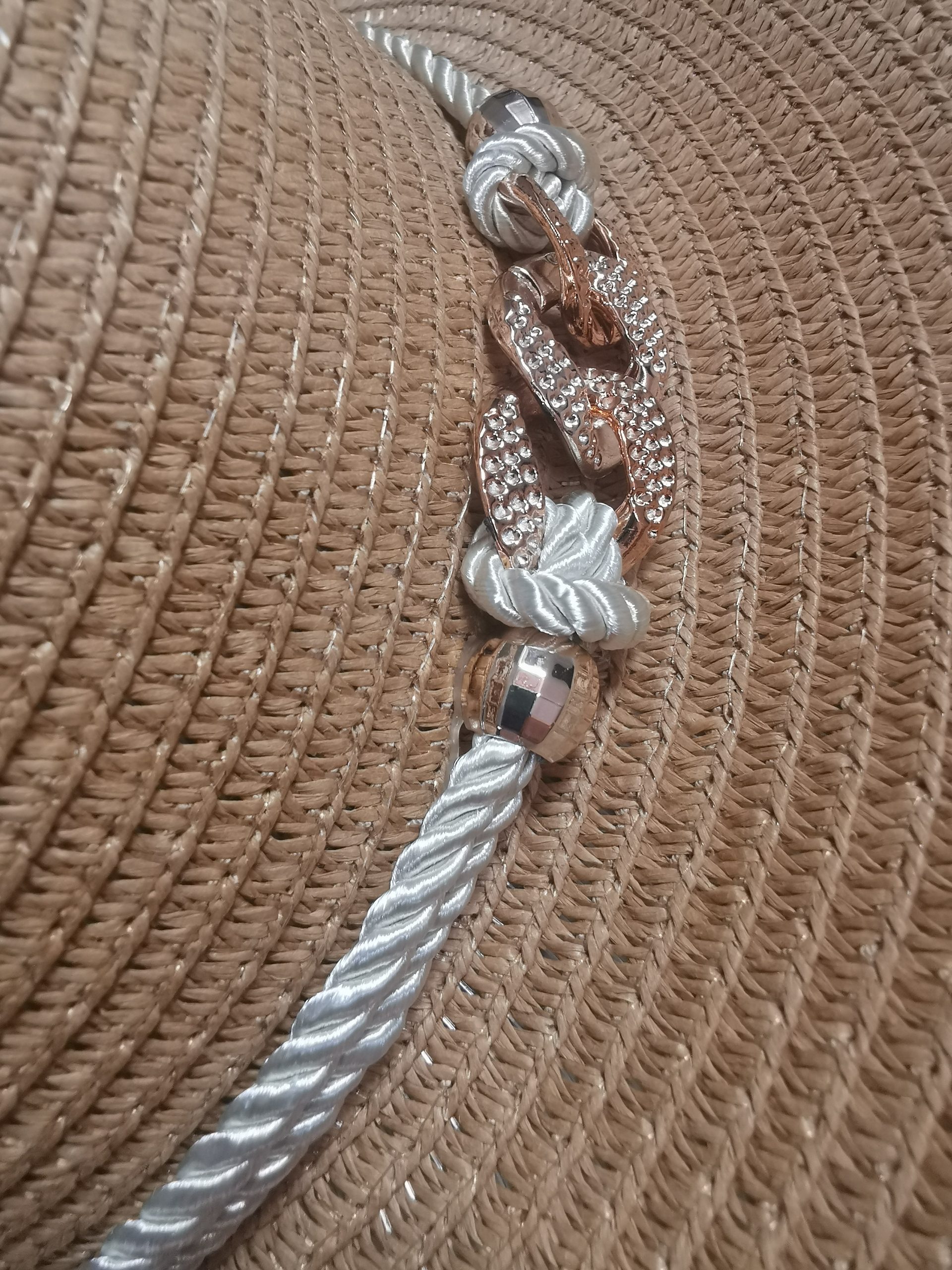 detail tan detail buckle and rope boater